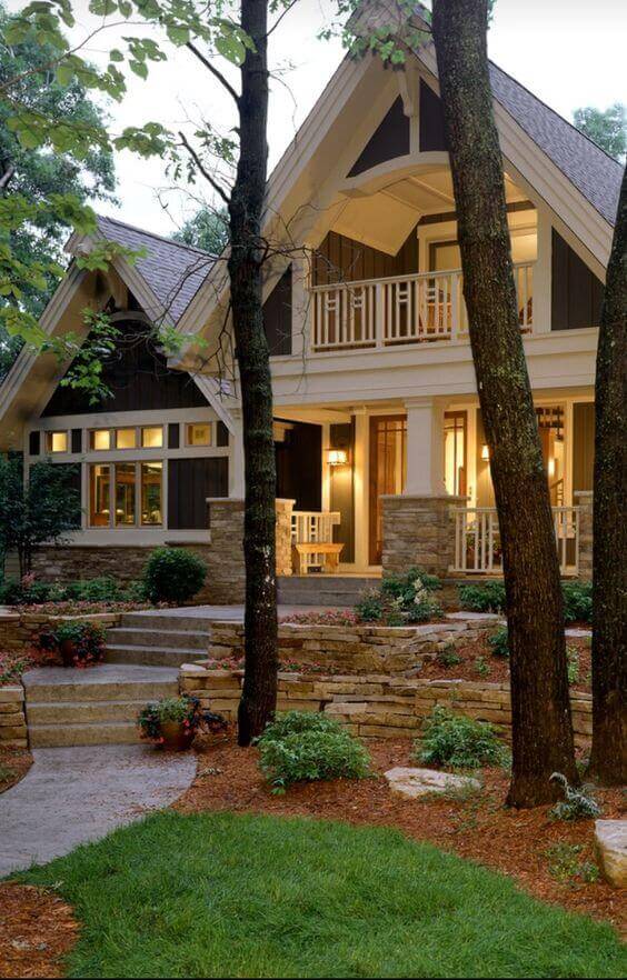 Front yard landscape featuring a paved walkway, low-maintenance shrubs, and tiered planters, enhancing curb appeal and harmony with nature.