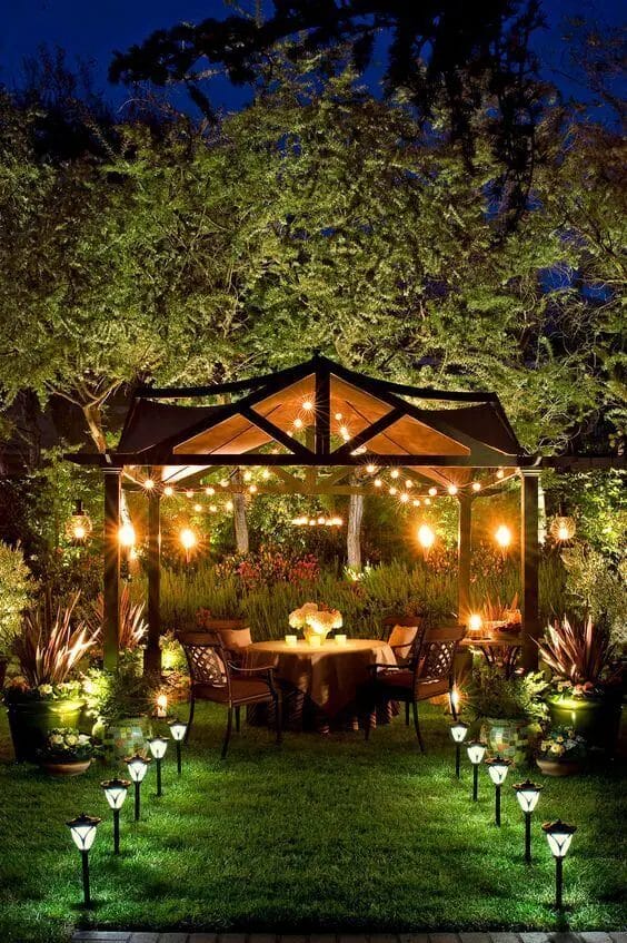 An outdoor pavilion lighting done right sure can make a dull space magical and unique. For more inspiration like this go to backyardmastery.com