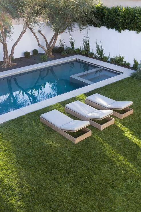 We found fantastic swimming pools surrounded by lovely landscapes complete with the best trees for pool landscape ideas you should not miss, especially if you are now designing or planning to renovate your yard. See more like this at backyardmastery.com