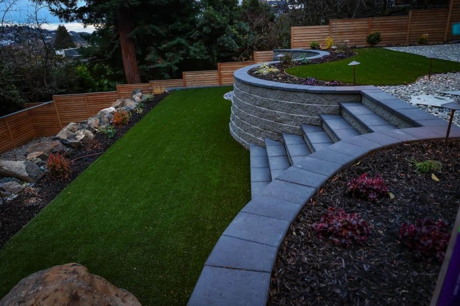 With some pallets, decks, trees and flower beds, you can do your backyard landscaping on a budget and still get the garden of your dreams just outside your place. Check more at backyardmastery.com