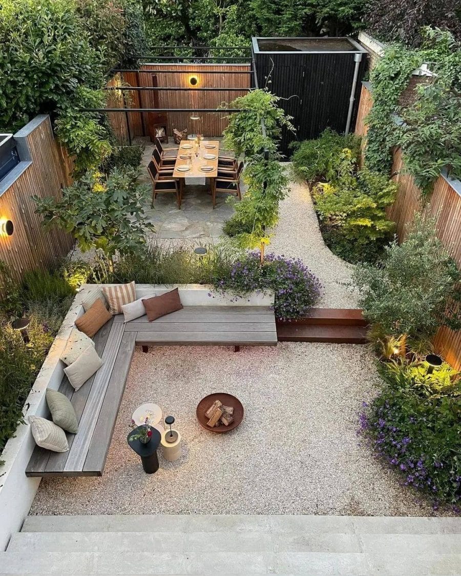 Modern garden featuring a gravel layout, wooden benches for gatherings, and a central dining table, surrounded by diverse plantings.